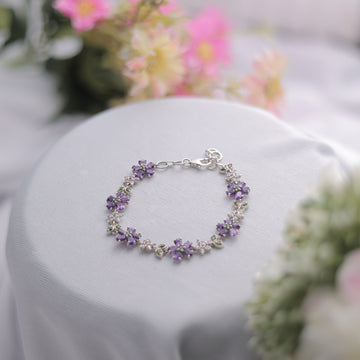 A delicate Amethyst Floral Bracelet with a floral gemstone setting.
