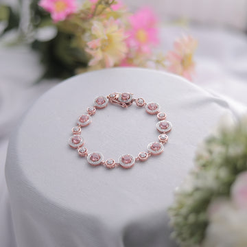 A Peach Round Cut Bracelet with Swarovski diamonds, glowing beautifully.