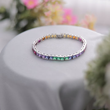 A Multi-Color Rainbow Tennis Bracelet, featuring a spectrum of gemstones.