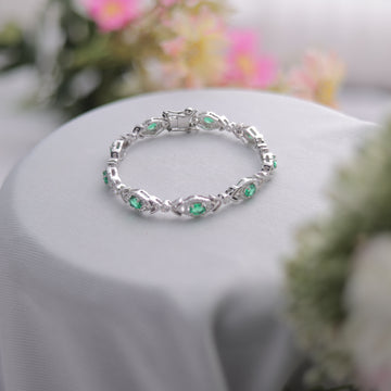 A stunning Green Oval Cut Bracelet, showcasing its vibrant hue.