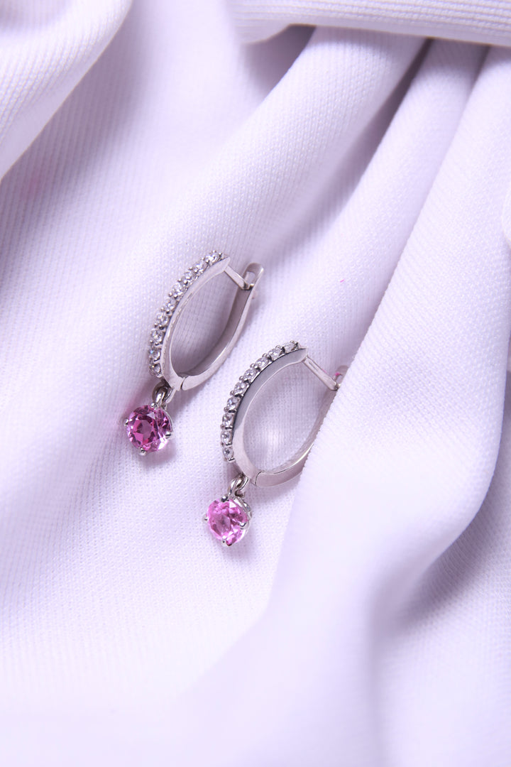  A close-up of Pink Hoop Dangling Earrings, shining in 925 sterling silver.