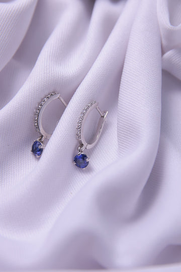 A stunning pair of Blue Hoop Dangling Earrings crafted in 925 sterling silver.
