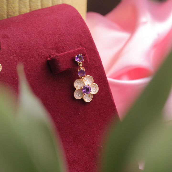 A model wearing Amethyst Floral Earrings, showcasing their elegance.