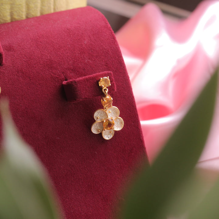 A close-up of Citrine Floral Earrings, capturing the golden hues of citrine gemstones.