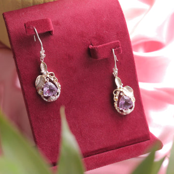 Kaizi Amethyst Earrings featuring a deep purple amethyst gemstone.
