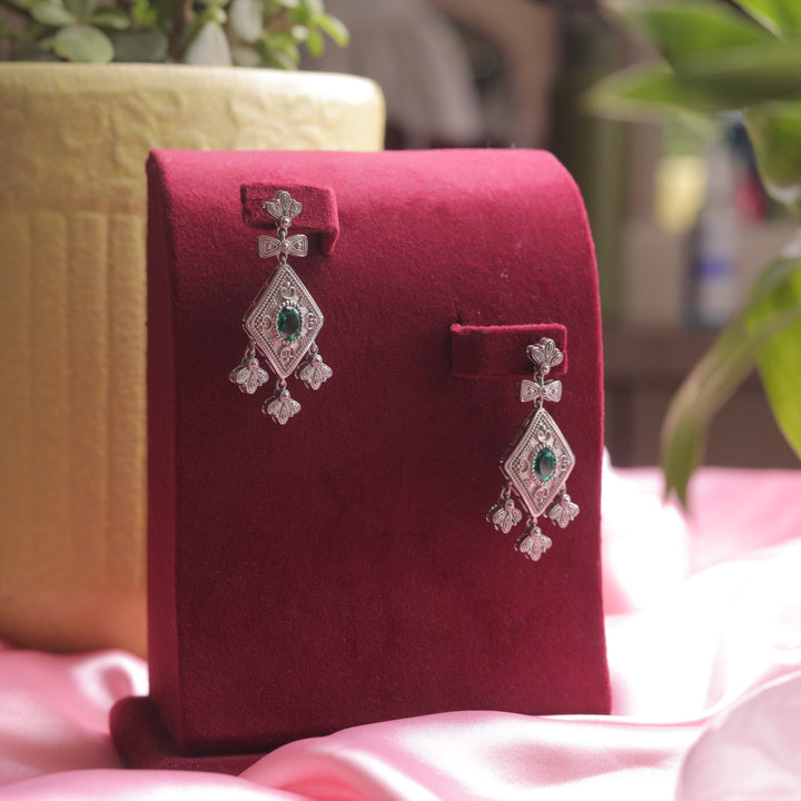 A detailed view of Oxidized Green Diamond Shape Earrings, featuring oxidized silver detailing.