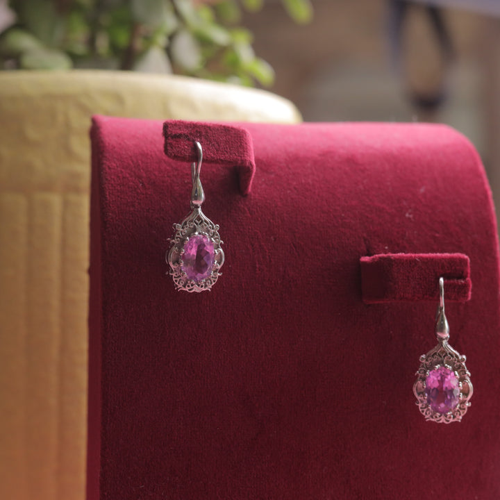 A woman wearing Kaizi Earrings (Pink), bringing out their soft and elegant look.