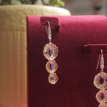 showcasing Kaizi Amethyst Earrings, highlighting their elegance.