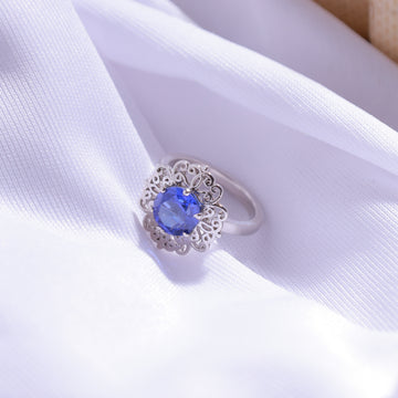 Dark Blue Floral Ring – detailed floral design with dark blue gemstone in 925 silver