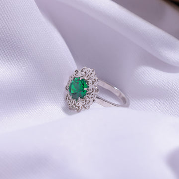 Close-up of Green Flower Ring – detailed floral design with a vibrant green gemstone