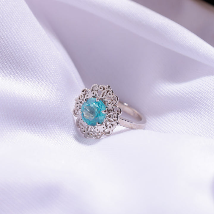 Close-up of Aqua Blue Flower Ring – delicate flower design with a gemstone