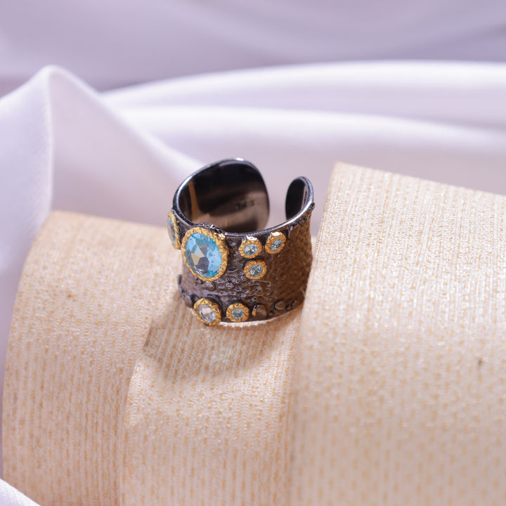 Close-up view of Blue Kaizi Ring – unique design with blue gemstone