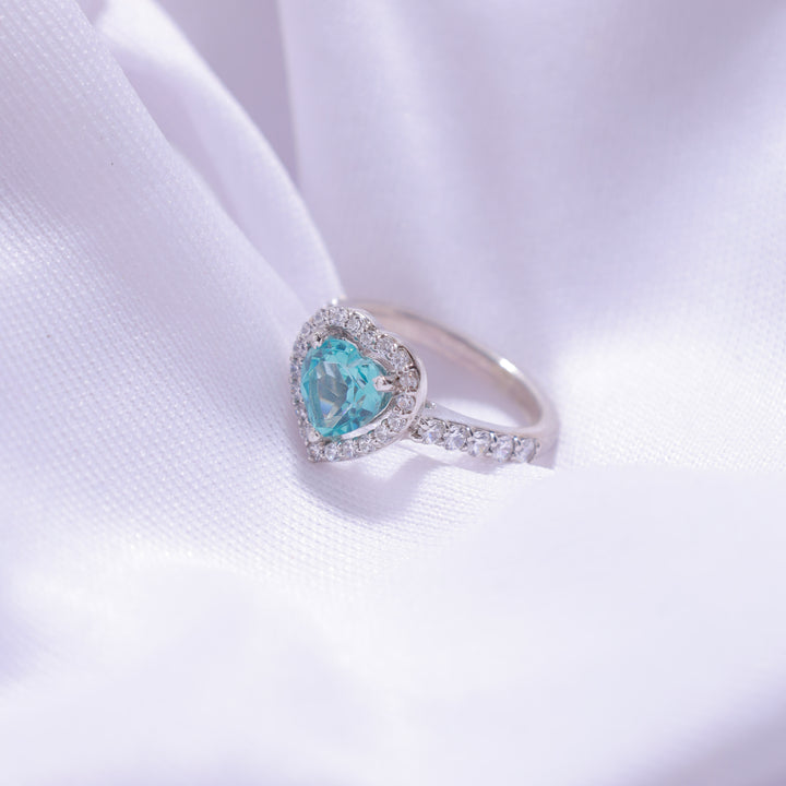 Close-up view of Aqua Blue Heart Ring – romantic design with silver band