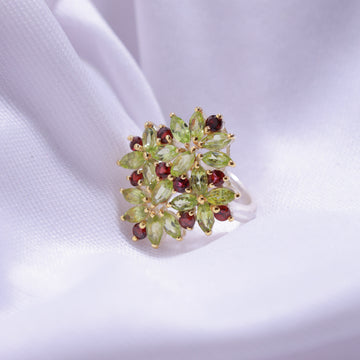 Close-up of Natural Garnet and Peridot Ring – vibrant gemstones in a silver band